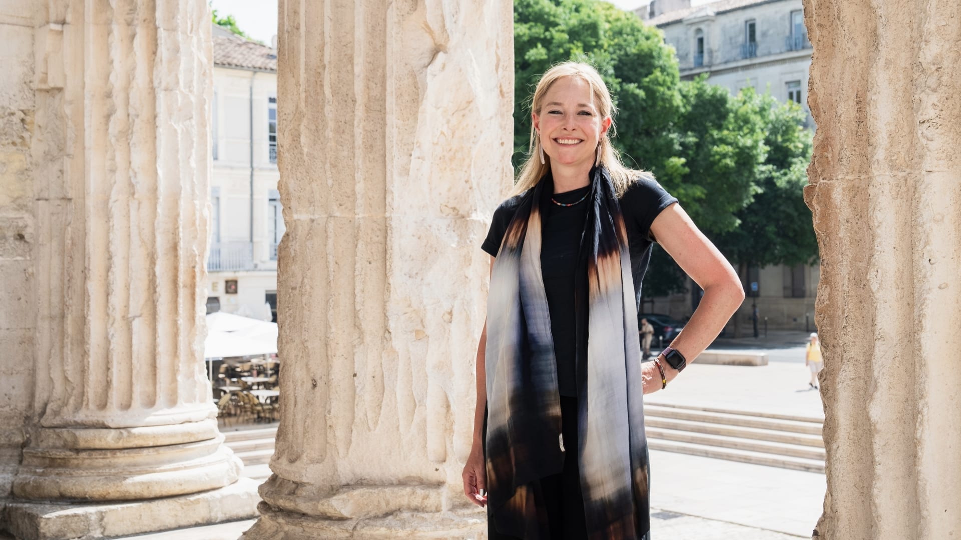 Professor Alice Roberts stood between Roman Columns